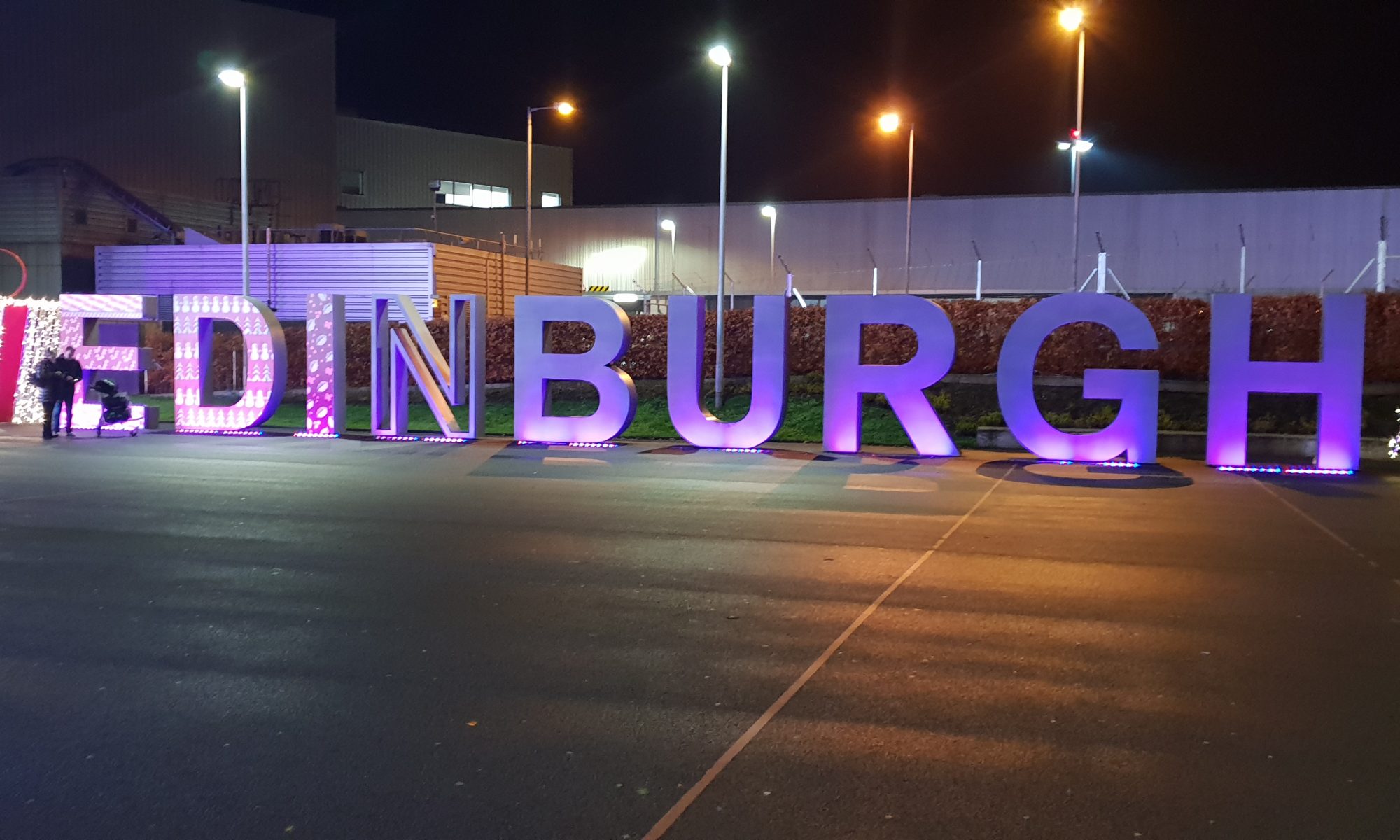 Edinburgh Airport sign next to tram stop